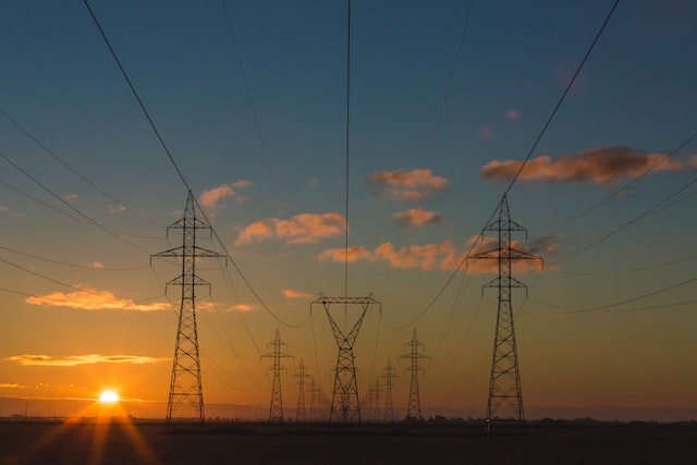 An illustration of energy infrastructure showcasing power lines and equipment.